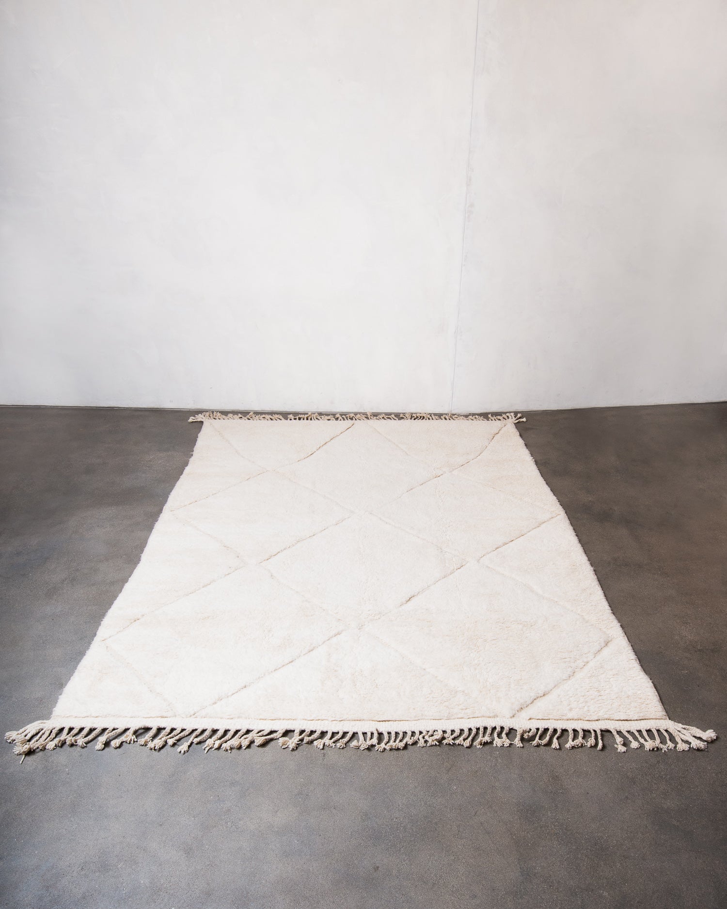 Modern, designer, handcrafted Berber rug from Morocco. Beniourain carpet with minimalist design, natural wool pile and a fluffy texture.